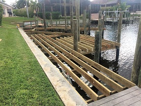 Picture showing a the finished framing of the boat deck with wood trusses