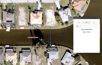 Picture of a Cape Coral property on a canal where the canal width is being measured
