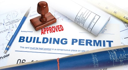 Picture of a building permit with an approved stamp on it