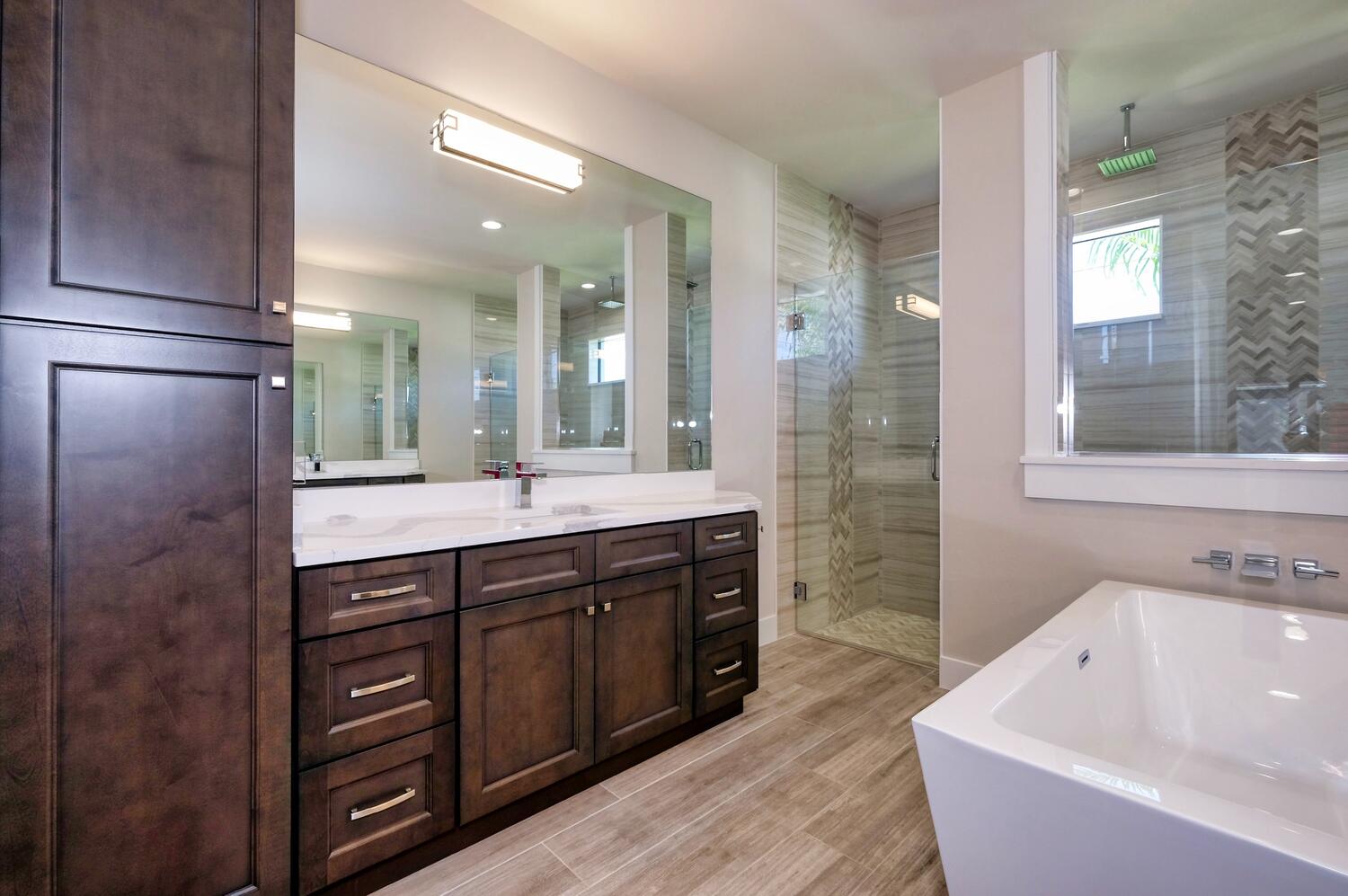 Picture of the cabinetry and vanity of the main bathroom of the model home Serenity